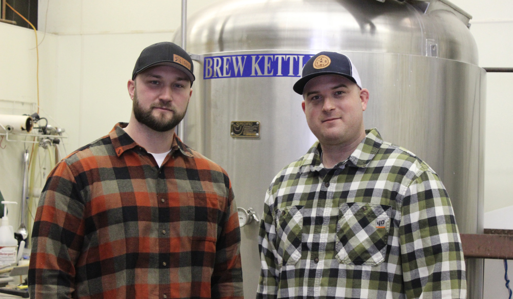 Matt Caple and Ben Gipson in front of the stainless brew kettle
